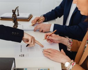 a couple signing their divorce papers