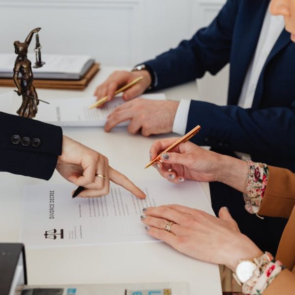 a couple signing their divorce papers